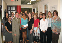 Bob Millard, local Allstate Agent, presenting the Hands in the Community Grant to Amanda Folk.